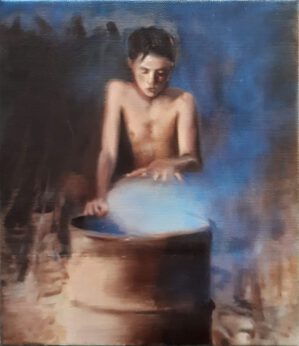 Boy making fire